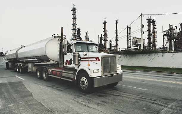 Semi Tanker Leaving Refinery A semi tanker truck departs from an oil refinery. fuel truck photos stock pictures, royalty-free photos & images