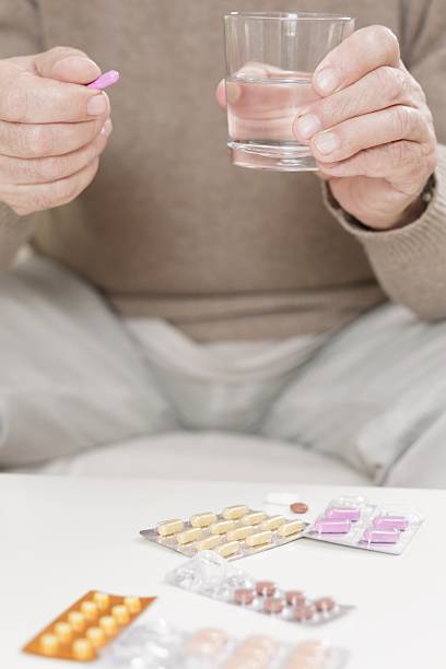 istock Close-up of man taking medicament 486516858