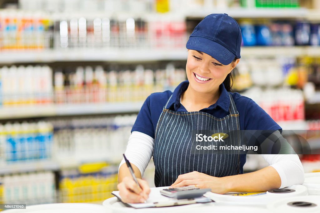 store clerk writing stock beautiful store clerk writing stock in supermarket Hardware Store Stock Photo