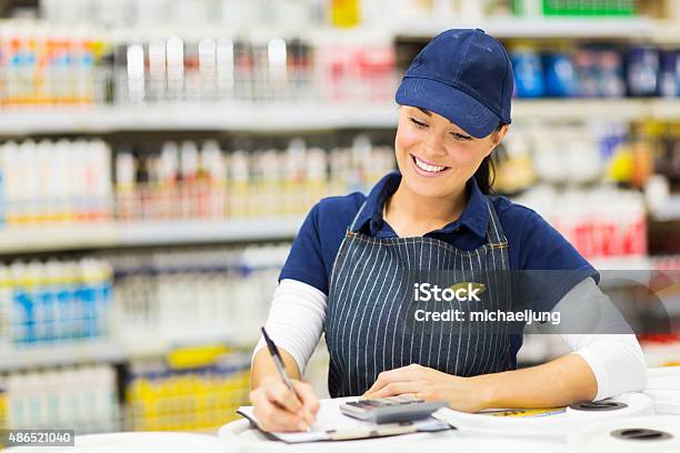 Store Clerk Writing Stock Stock Photo - Download Image Now - Hardware Store, 2015, Adult