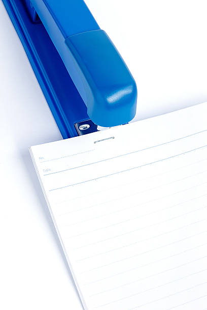 istock sheets of paper stapled by stapler 486522083