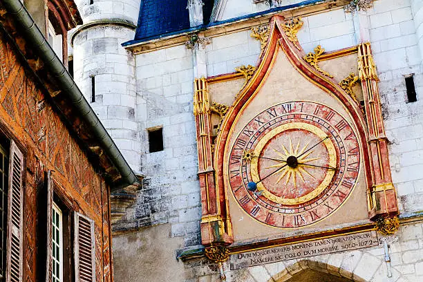 The Clock Tower in the Old Town district of Auxerre in the Burgundy region of France. The tower dates from 1483 with the clock added in the 17th century. Its hands show the time, and the phase of the Moon. AdobeRGB colorspace.