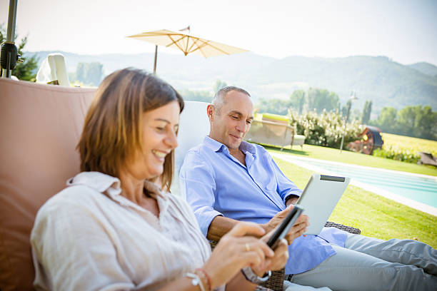 istock couple surfing on the web at resort 486522571