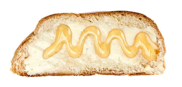 Wheat bread slice (yeast braid) with honey