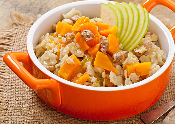 istock Oatmeal with pumpkin, apples, nuts and honey 486522797