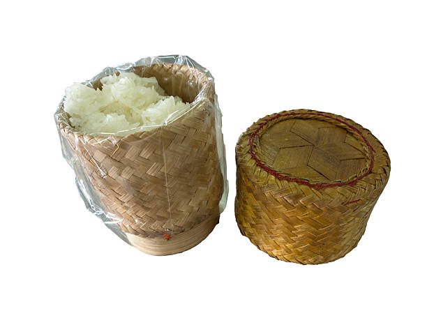 istock Thai sticky rice in a bamboo wooden old style box 486523393