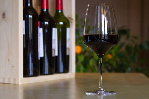 istock Glass of red wine in the interior 486523692