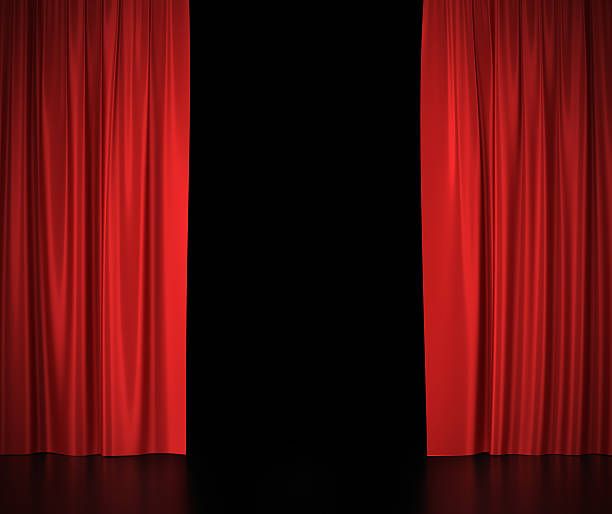 istock Open red silk curtains for theater and cinema spotlit light 486524074