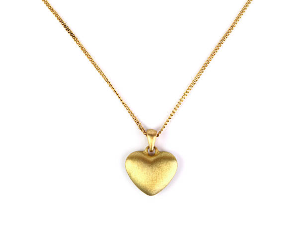 Heart pendant Golden heart pendant isolated on white pendant stock pictures, royalty-free photos & images