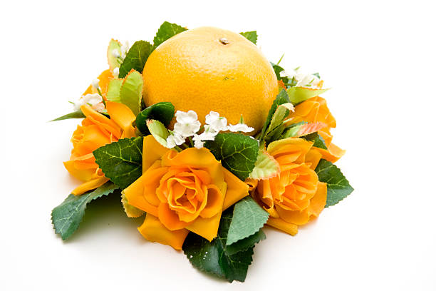Orange with rose flower arrangement on white background