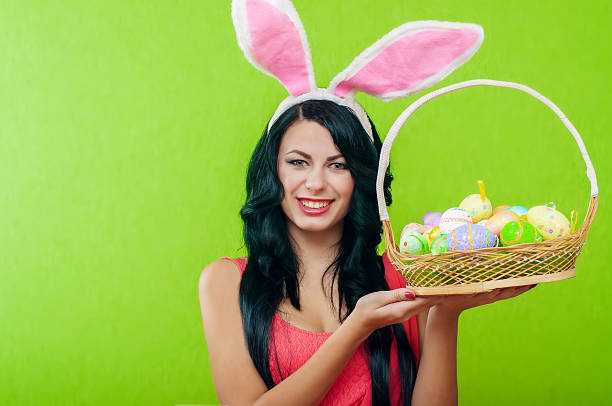 istock Beautiful girl with a basket of Easter eggs 486526443