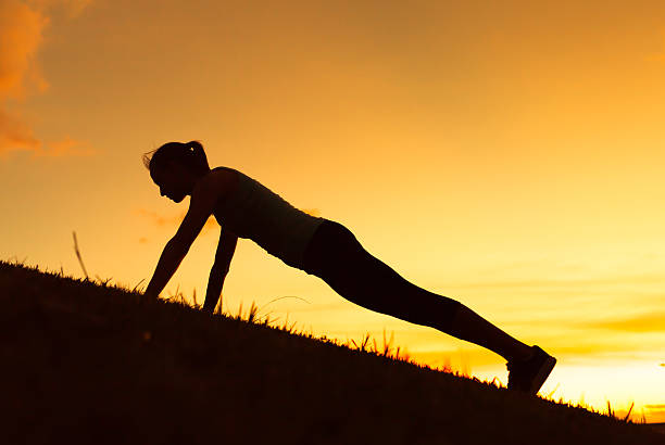 istock Young woman exercising in the park 486527170