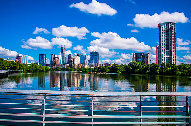 istock Riverside Pedestrian Bridge Blue Days Austin Texas Cityscape Reflections 486527890