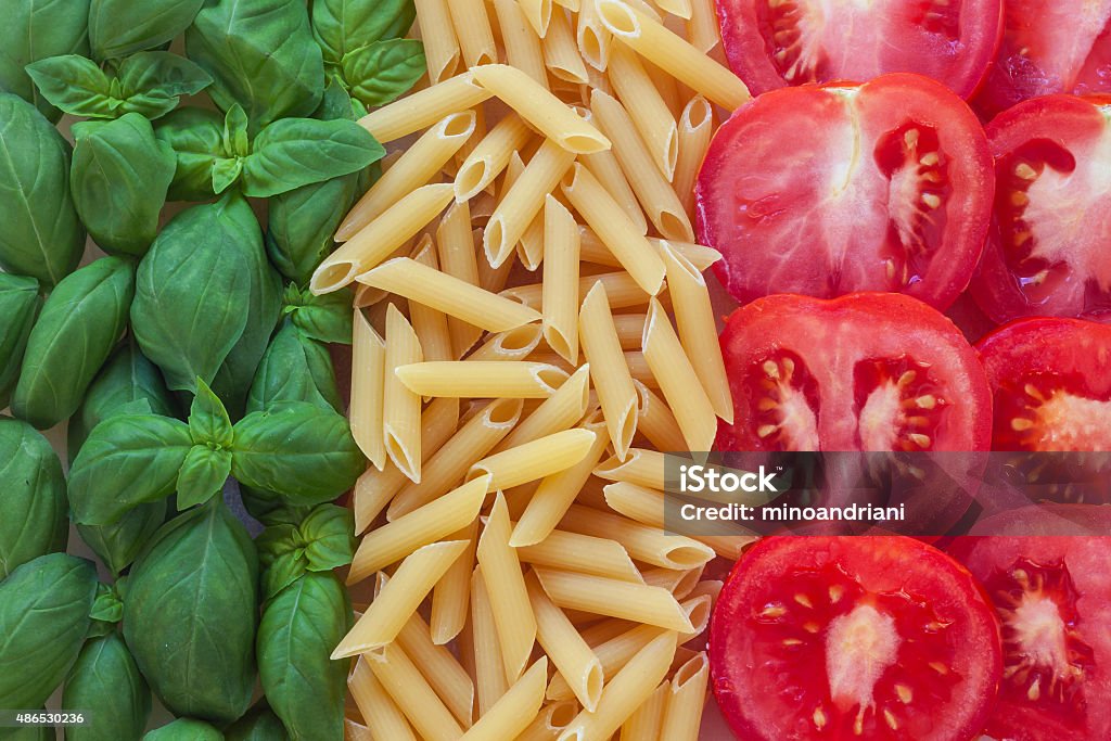 italian food with background italian food with background - pasta, tomato, basil Italy Stock Photo