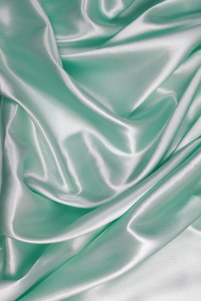 istock Light green Silk cloth of wavy abstract background 486531682