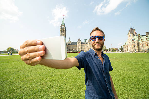 istock One traveler man taking selfie in Ottawa 486533572