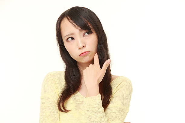 istock young Japanese woman worries about something 486534268