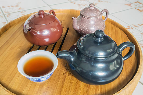 istock Chinese Teapot on teapot stand, made of bamboo. 486534916