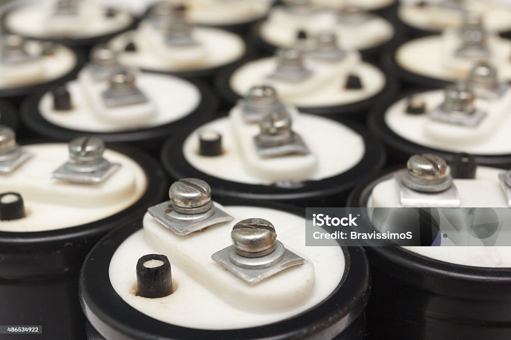 Electrolytic capacitor Collection Electrolytic capacitor with two black Clem plus and minus. Isolated on white background 2015 Stock Photo