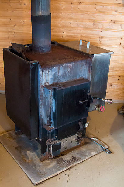 istock Old fashioned wood stove in a cabin 486540898