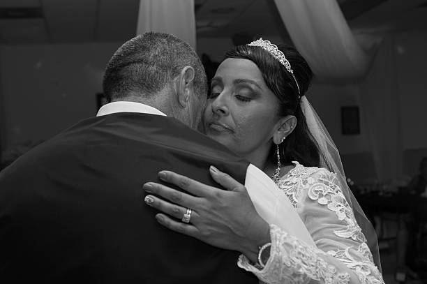 istock Groom holding his new bride close 486543506