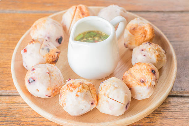 istock Squid grilled ball on wooden plate 486544414