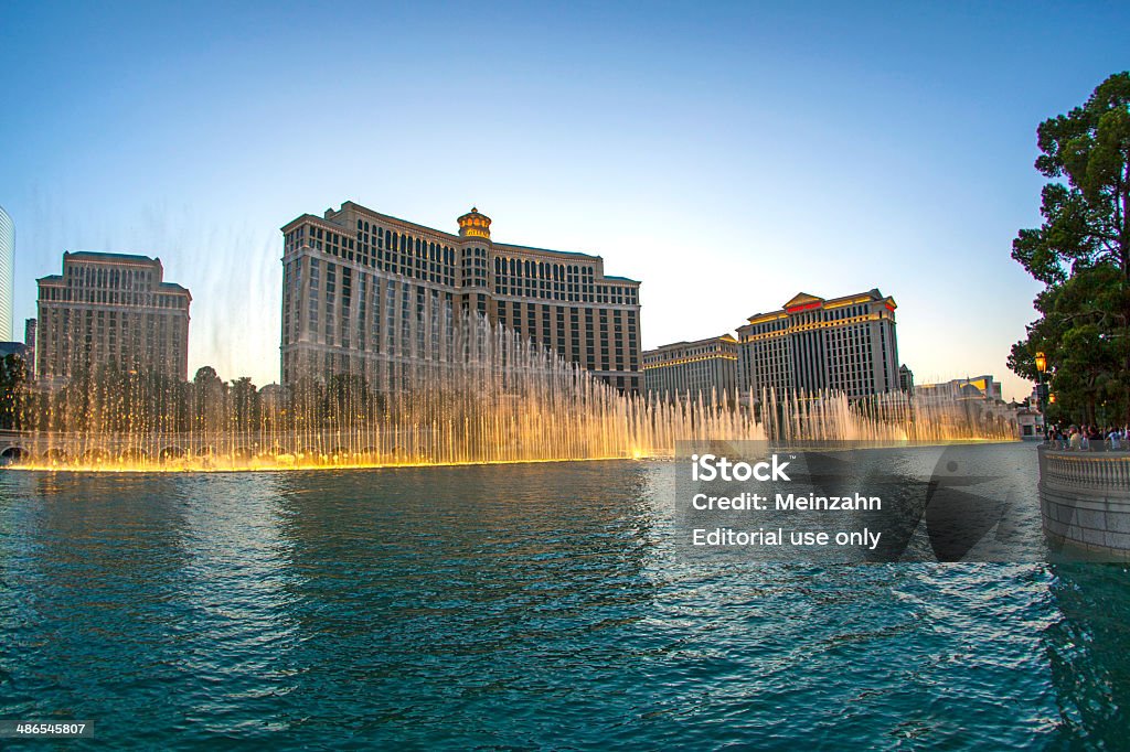 famous Bellagio Hotel with water games in Las Vegas Las Vegas, USA - June 15, 2012: Las Vegas Bellagio Hotel Casino, featured with its world famous fountain show, at night with fountains in Las Vegas, Nevada. Architecture Stock Photo