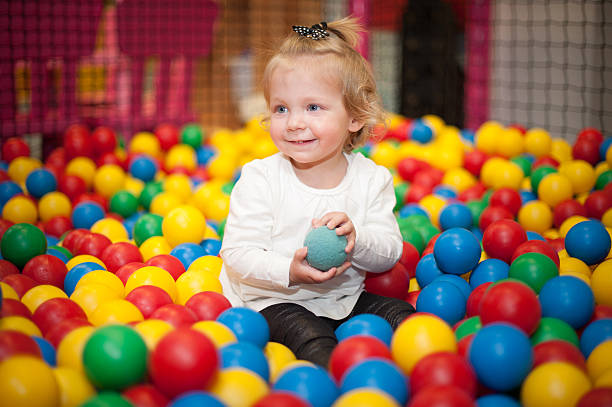 istock Baby girl in ball pool 486548567
