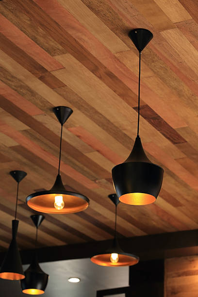 istock black pendant lamp on ceiling wood wall 486550670