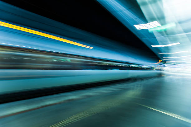 istock fast train traveling at high speed through a station 486551074
