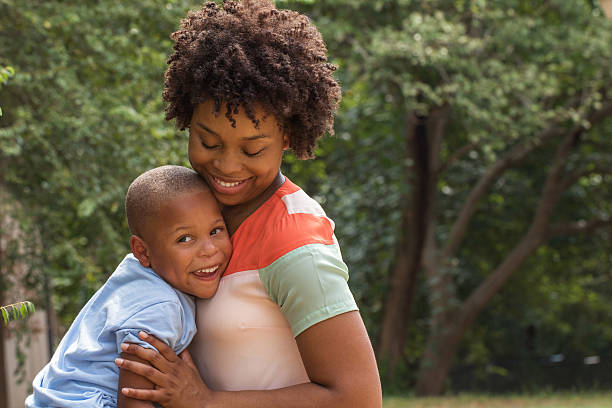 istock African American mother holding her son. 486551690