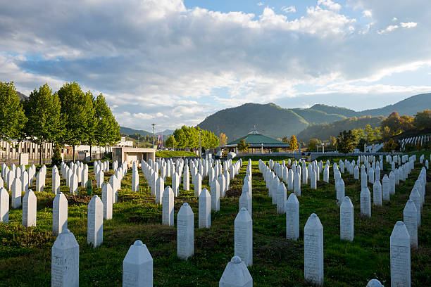 Srebrenica massacre Potočari, Bosnia and Herzegovina - October 10, 2013: Some of the more than 6000 graves at the Srebrenica-Potočari Genocide Memorial and Cemetery, where the remains of Bosnian Muslims killed by Bosnian Serbs have been laid to rest. ethnic cleansing stock pictures, royalty-free photos & images