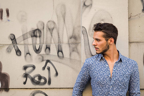 istock Young handsome man posing in the city streets 486551880