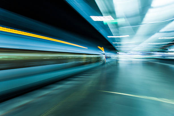istock fast train traveling at high speed through a station 486552128