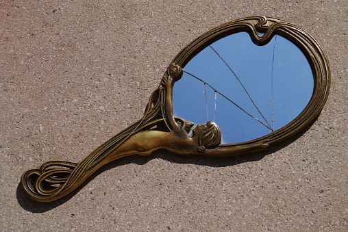 broken art nouveau hand mirror