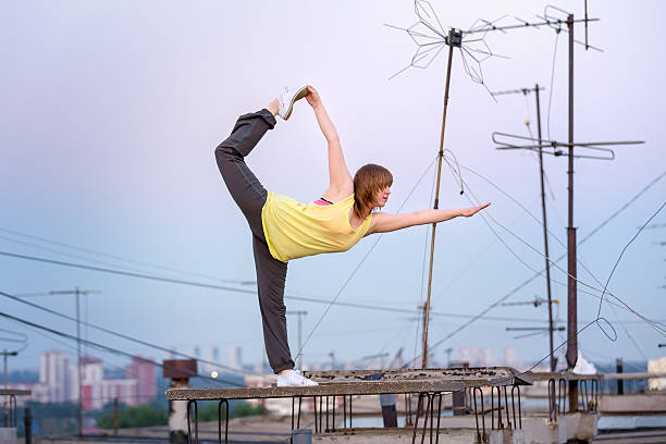 relaxing yoga on the roof at sunset