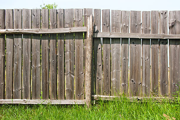 istock Classic aged wooden fence as a background texture 486553100
