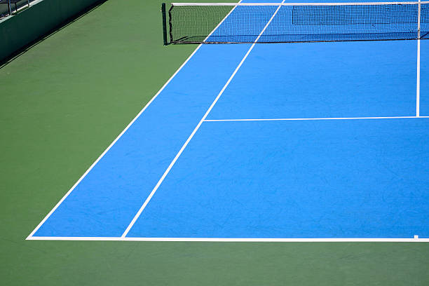 istock blue and green tennis court 486553596