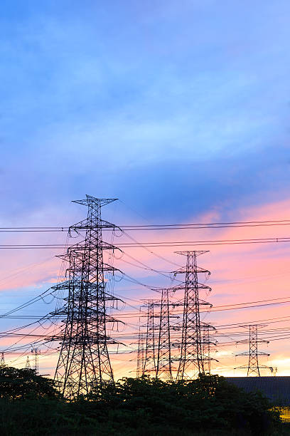 istock Silhouette power transmission tower  during twilight time 486553732