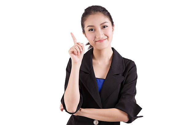 istock business woman pointing up isolated on white 486557724