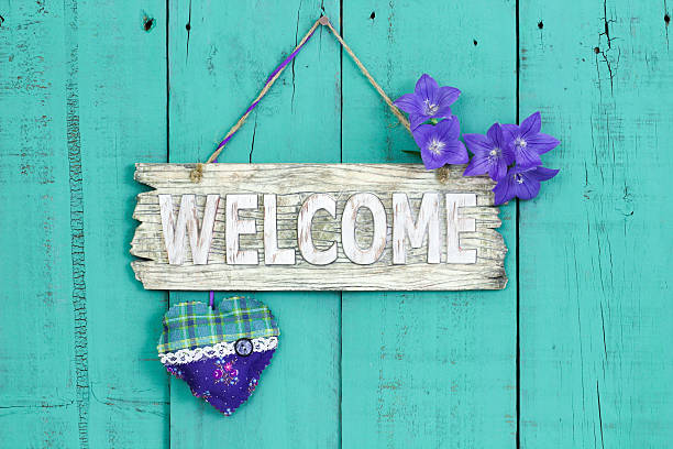 istock Welcome sign with heart and flowers 486559028