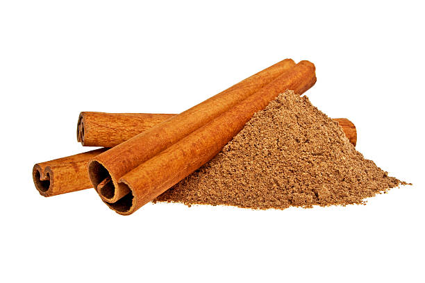 istock Cinnamon sticks and powder on white background 486559112