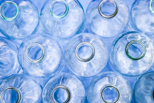 istock Clean empty blue glass transparent bottle rows directly above 486559796