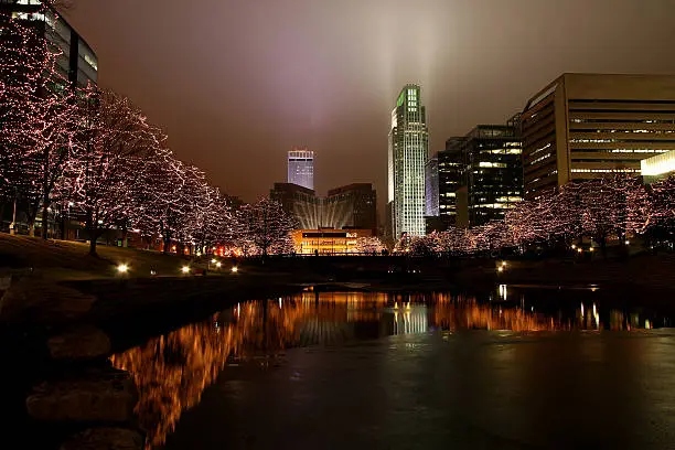 The Gene Leahy Mall in Omaha, NE looking west at the skyline during the holiday season.