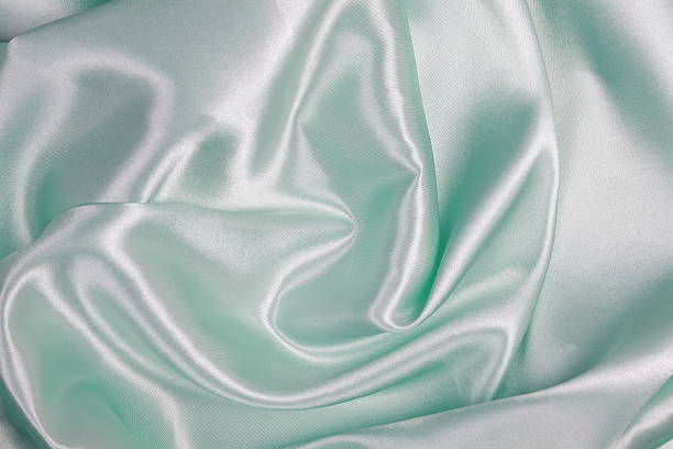 istock Light green Silk cloth of wavy abstract background 486561606