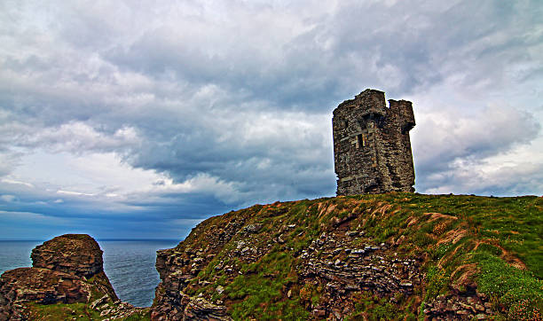 istock Moher Tower on rocky Hags Head on Cliffs of Moher 486562742