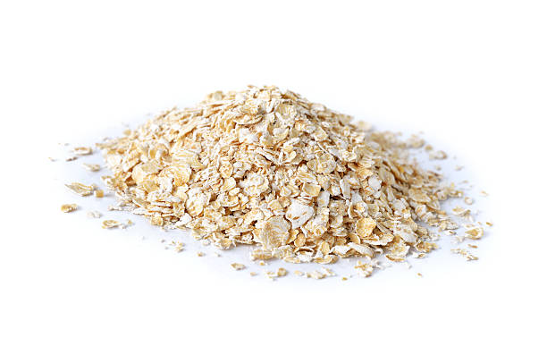 istock pile of instant oatmeal on white background 486563488