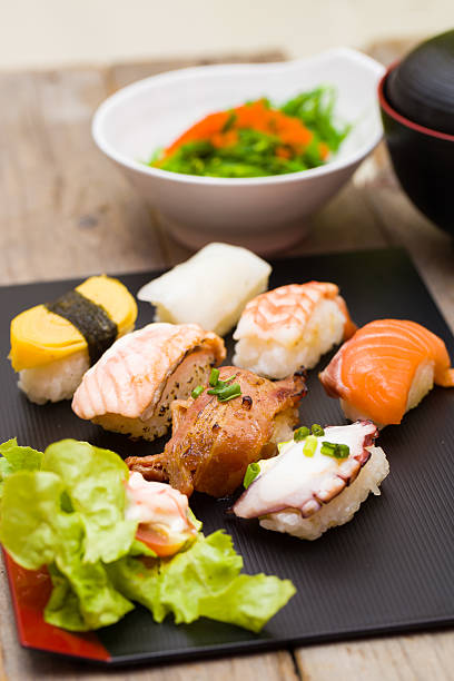 istock Sushi assortment on black dish, close up 486566528
