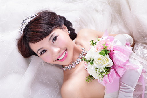 beauty portrait of bride with roses , asian woman beauty