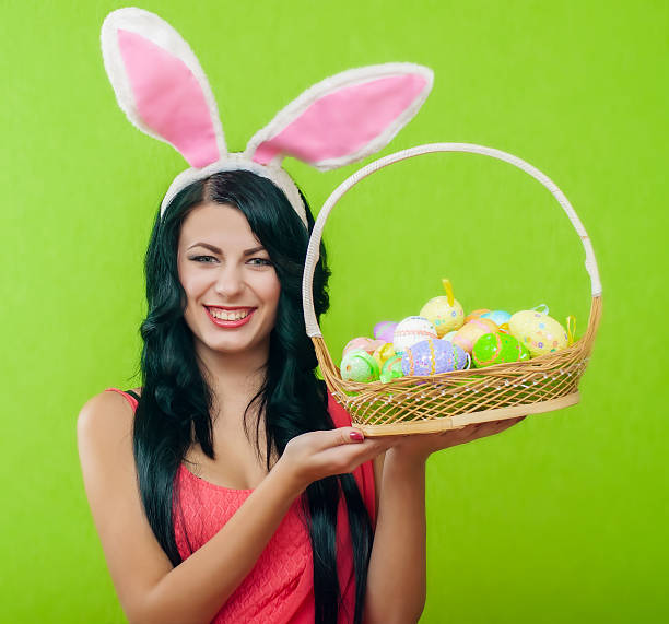 istock Beautiful girl with a basket of Easter eggs 486567429